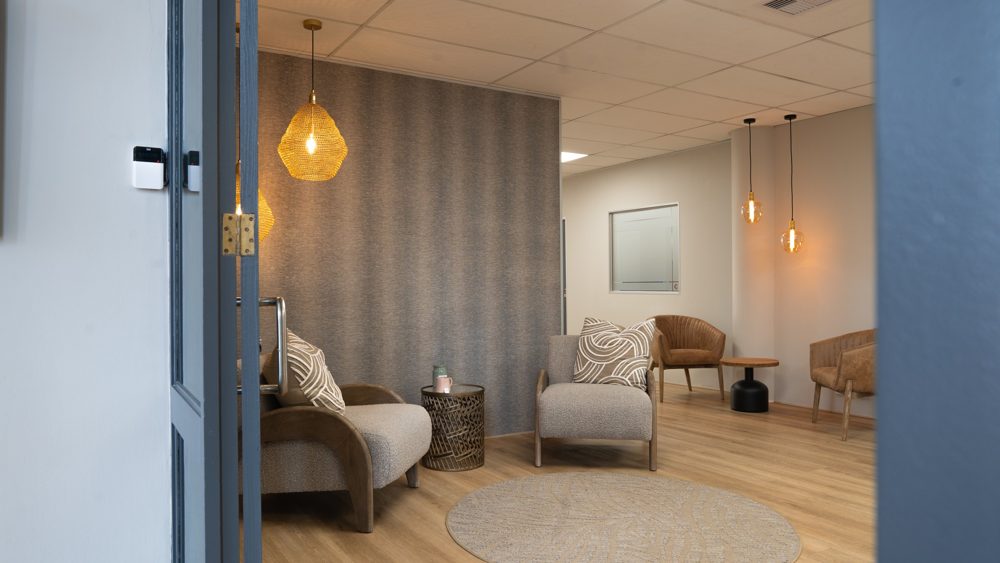 Quiet lounge viewed through glass doors