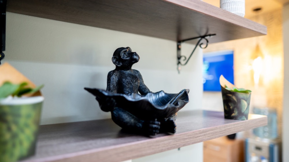 Decorative monkey sculpture in a shared space